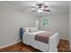 Bedroom featuring a queen-sized bed, ceiling fan, hardwood floors, and natural light at 101 Wynnchester Rd, Gastonia, NC 28056