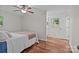 Bedroom featuring a queen-sized bed, ceiling fan, hardwood floors, and natural light at 101 Wynnchester Rd, Gastonia, NC 28056