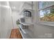 Walk-in closet with custom shelving for storage, wooden floor, and a window at 101 Wynnchester Rd, Gastonia, NC 28056