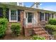 Charming brick home featuring black shutters, dormers, and a cozy front entrance at 101 Wynnchester Rd, Gastonia, NC 28056