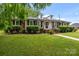 Charming brick home featuring manicured landscaping, dormer windows and classic black shutters at 101 Wynnchester Rd, Gastonia, NC 28056