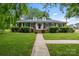 Well-maintained brick home with a manicured lawn, sidewalk, and mature landscaping at 101 Wynnchester Rd, Gastonia, NC 28056
