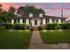 Charming brick home with well-manicured lawn and shrubbery, featuring dormer windows and a welcoming walkway at 101 Wynnchester Rd, Gastonia, NC 28056