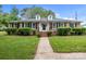 Charming brick home with well-manicured lawn and shrubbery, featuring dormer windows and a welcoming walkway at 101 Wynnchester Rd, Gastonia, NC 28056