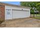 A detached two car garage featuring a side entry door and attached basketball court at 101 Wynnchester Rd, Gastonia, NC 28056