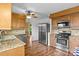Well-equipped kitchen with stainless steel appliances, granite countertops, and wooden cabinetry at 101 Wynnchester Rd, Gastonia, NC 28056