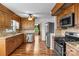 Spacious eat-in kitchen with stainless steel appliances, granite countertops and wood flooring at 101 Wynnchester Rd, Gastonia, NC 28056
