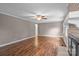 Bright living room with wood flooring, traditional fireplace, and ceiling fan at 101 Wynnchester Rd, Gastonia, NC 28056