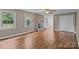 Spacious living room with wood flooring, brick fireplace, and ample natural light at 101 Wynnchester Rd, Gastonia, NC 28056