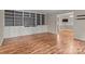 Spacious living room featuring hardwood floors and built-in shelving and cabinets at 101 Wynnchester Rd, Gastonia, NC 28056