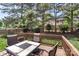 Relaxing backyard deck with outdoor furniture and a view of the lush lawn at 1011 Master Gunner Ct, Indian Trail, NC 28079