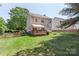 Spacious backyard with a well-maintained lawn and deck, perfect for outdoor living at 1011 Master Gunner Ct, Indian Trail, NC 28079