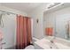 Well-lit bathroom with a shower-tub combo, a vanity, and towel racks at 1011 Master Gunner Ct, Indian Trail, NC 28079