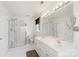 Bright bathroom featuring double sinks, large mirror, shower and toilet at 1011 Master Gunner Ct, Indian Trail, NC 28079