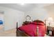 Bedroom features a decorative four-poster bed, closet and dresser with lamps at 1011 Master Gunner Ct, Indian Trail, NC 28079