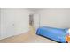 Bedroom with a twin bed, closet and access to the home's second level at 1011 Master Gunner Ct, Indian Trail, NC 28079