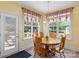 Sunny dining area with a wooden table, seating for six, and lots of natural light at 1011 Master Gunner Ct, Indian Trail, NC 28079