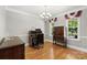 Formal dining room with hardwood floors, elegant chandelier, and classic furnishings at 1011 Master Gunner Ct, Indian Trail, NC 28079