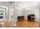 Formal dining room with hardwood floors, elegant chandelier, and classic furnishings at 1011 Master Gunner Ct, Indian Trail, NC 28079