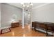 Spacious dining room featuring hardwood floors and elegant furniture at 1011 Master Gunner Ct, Indian Trail, NC 28079