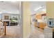 Open-concept hallway leading to the living room and kitchen with ample natural light at 1011 Master Gunner Ct, Indian Trail, NC 28079
