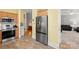 This kitchen features stainless appliances including a refrigerator, oven, and microwave at 1011 Master Gunner Ct, Indian Trail, NC 28079