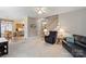 Bright living room features a view into the kitchen and comfortable seating at 1011 Master Gunner Ct, Indian Trail, NC 28079