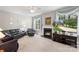 Inviting living room featuring a fireplace, large windows, and comfortable seating at 1011 Master Gunner Ct, Indian Trail, NC 28079