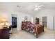Large main bedroom featuring ensuite bathroom, closet and vaulted ceiling with fan at 1011 Master Gunner Ct, Indian Trail, NC 28079