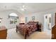 Spacious main bedroom with vaulted ceiling, fan, large window, and ensuite bathroom at 1011 Master Gunner Ct, Indian Trail, NC 28079