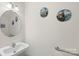 Simple powder room features a sink, mirror, and decorative artwork at 1011 Master Gunner Ct, Indian Trail, NC 28079