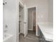 Bathroom with tub and shower combo and modern shaker cabinets at 102 Erwin St, Chester, SC 29706