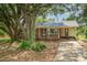 Charming single-story brick home with a mature shade tree in a suburban setting at 102 Erwin St, Chester, SC 29706
