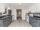 Well-lit kitchen with ample counter space, modern appliances, and wood-look floors at 102 Erwin St, Chester, SC 29706