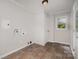 Clean laundry room with tile floors, window, and laundry hookups installed at 102 Erwin St, Chester, SC 29706