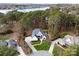 Stunning aerial view of an estate home, lush landscaping, mature trees, and a private driveway at 107 Waterhouse Ct, Mooresville, NC 28117