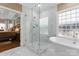Bright bathroom with walk-in shower and soaking tub, adjoining bedroom at 107 Waterhouse Ct, Mooresville, NC 28117