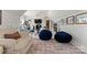 Spacious exercise room with gym equipment, TV, and comfortable seating at 107 Waterhouse Ct, Mooresville, NC 28117
