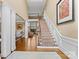 Grand foyer with hardwood floors, staircase, and fireplace visible in the background at 107 Waterhouse Ct, Mooresville, NC 28117
