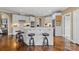 Open kitchen boasts a large island with seating, white cabinets, and stainless appliances at 107 Waterhouse Ct, Mooresville, NC 28117