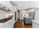 Bright kitchen showcases white cabinets, stainless steel appliances, and a gray island at 107 Waterhouse Ct, Mooresville, NC 28117