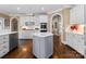 Spacious kitchen with a center island, white cabinets, and wood flooring at 107 Waterhouse Ct, Mooresville, NC 28117