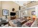 Open-concept living room with high ceilings, lots of natural light, and comfortable seating at 107 Waterhouse Ct, Mooresville, NC 28117