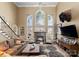 Open living room features a large fireplace, high ceilings and bright windows at 107 Waterhouse Ct, Mooresville, NC 28117