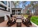 Charming brick patio featuring Adirondack chairs gathered around a fire pit, great for outdoor entertaining at 107 Waterhouse Ct, Mooresville, NC 28117