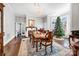 Elegant dining room with hardwood floors, a fireplace, and a chandelier at 121 York St, Chester, SC 29706