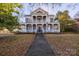 Charming two-story home featuring a covered front porch and classic architectural details at 121 York St, Chester, SC 29706