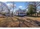 Two-story blue home with a wrap-around porch and a well-manicured front lawn at 121 York St, Chester, SC 29706