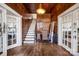 Grand foyer showcasing a staircase, hardwood floors, and vintage charm at 121 York St, Chester, SC 29706