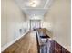 Long hallway with hardwood floors, vintage features, and natural light at 121 York St, Chester, SC 29706